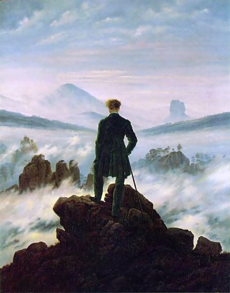 man standing on a cliff